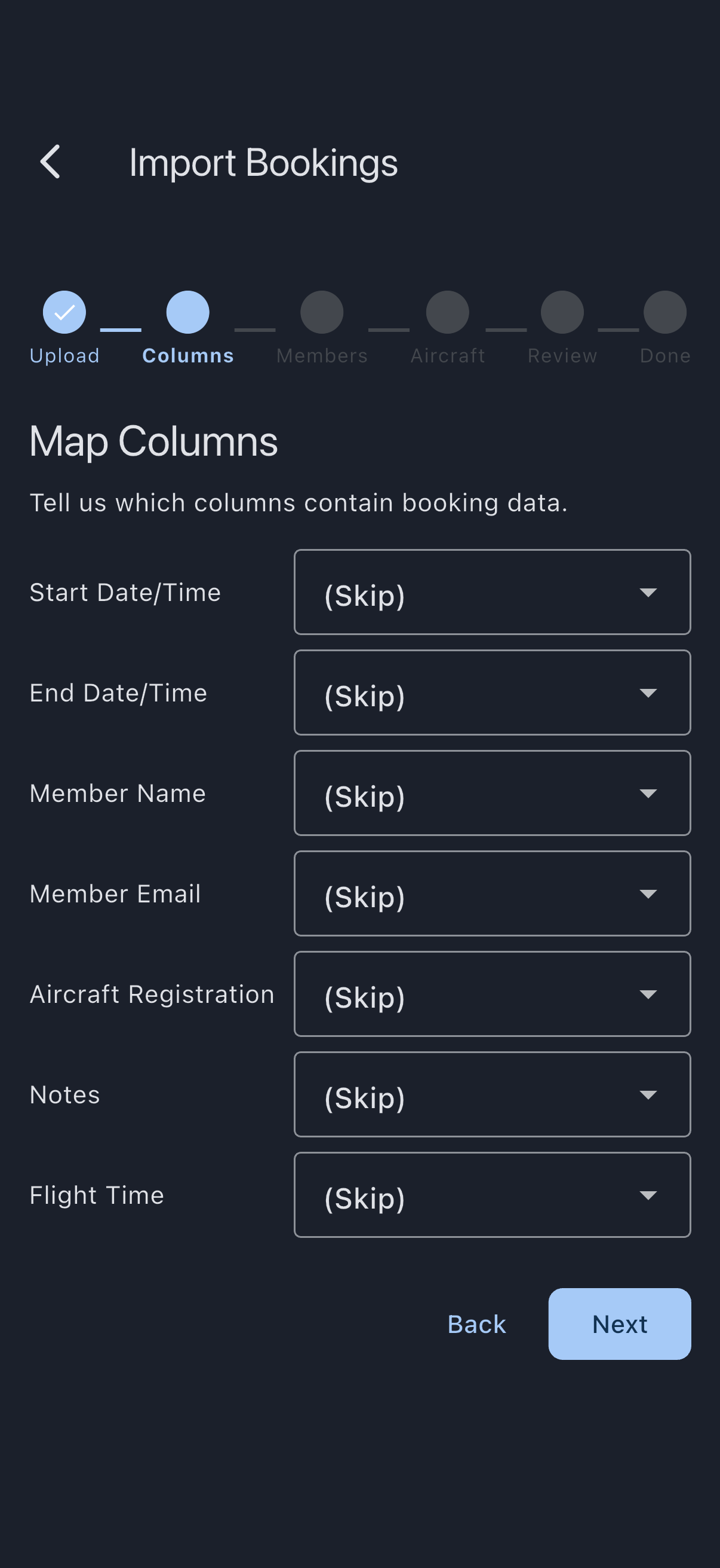 The Map Columns step of the import wizard, with the six-dot step indicator above a row per Syndik8 field, each paired with a dropdown listing the columns found in the uploaded CSV