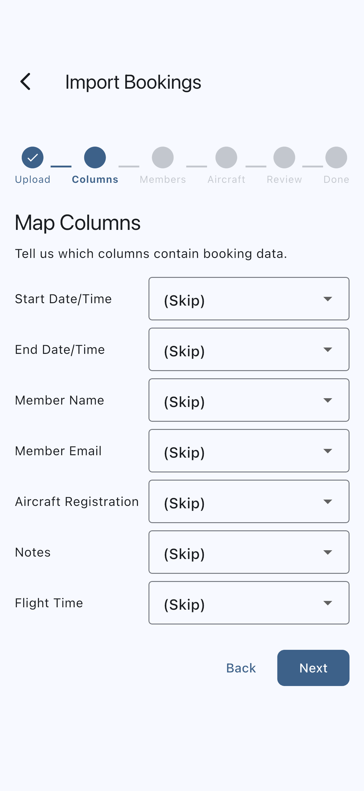 The Map Columns step of the import wizard, with the six-dot step indicator above a row per Syndik8 field, each paired with a dropdown listing the columns found in the uploaded CSV