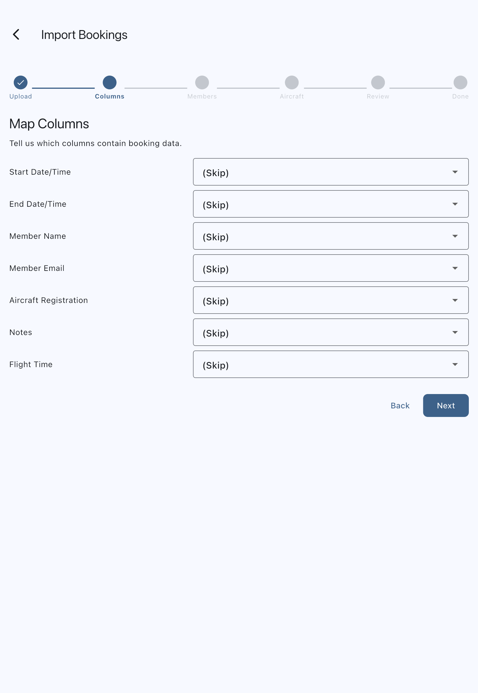 The Map Columns step of the import wizard, with the six-dot step indicator above a row per Syndik8 field, each paired with a dropdown listing the columns found in the uploaded CSV