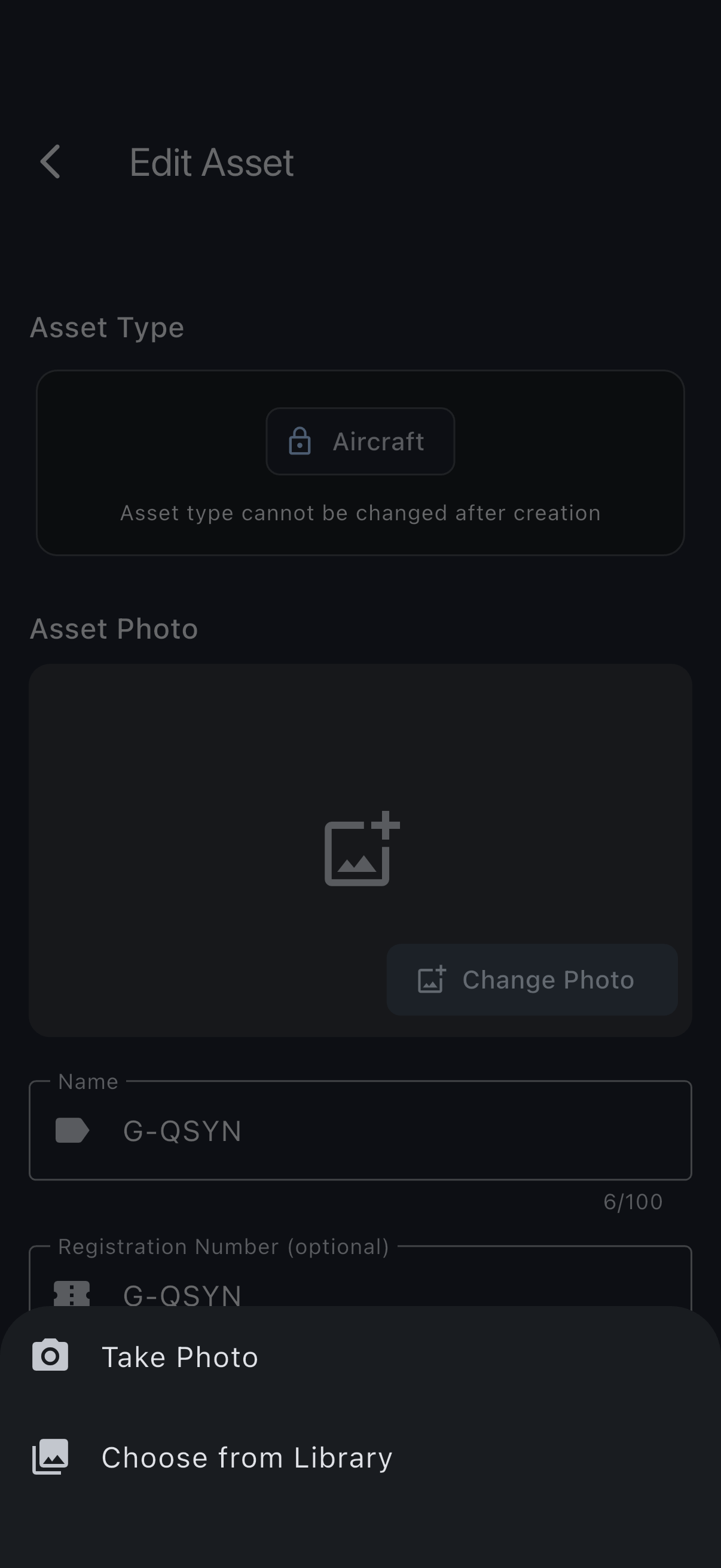 The Edit Asset screen with the Asset Photo section near the top, its Change Photo button, and the source picker offering the camera or the photo library